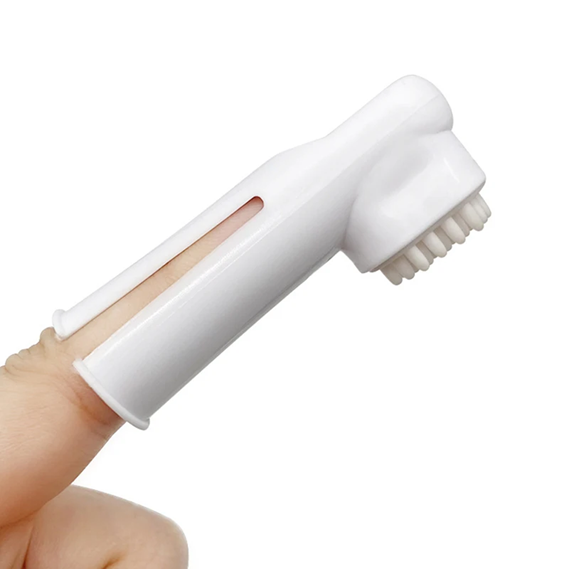 White handheld scrubber with bristles on a white background